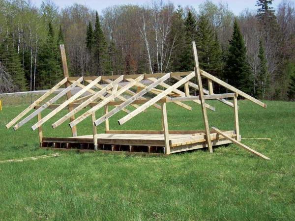 
This movable chicken tractor, when covered with a tarp, is a great option for raising pastured poultry flocks because it can be moved to encourage the birds to forage in different areas.
